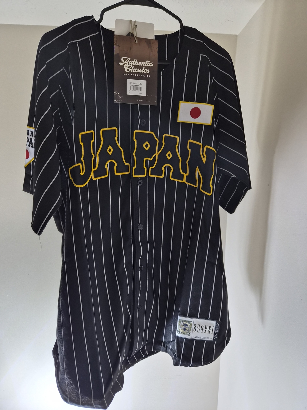 Black Pinstripe 'JAPAN' Baseball Jersey with Yellow Trim